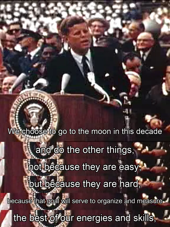 John F. Kennedy speaking at Rice University in 1962, with six added English script-subtitle lines including “We choose to go to the moon” and “not because they are easy, but because they are hard”.